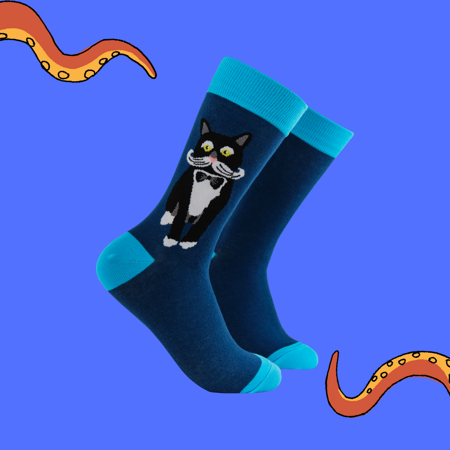 A pair of socks featuring a posh looking cat. Blue legs, light blue heel, toe and cuff. 