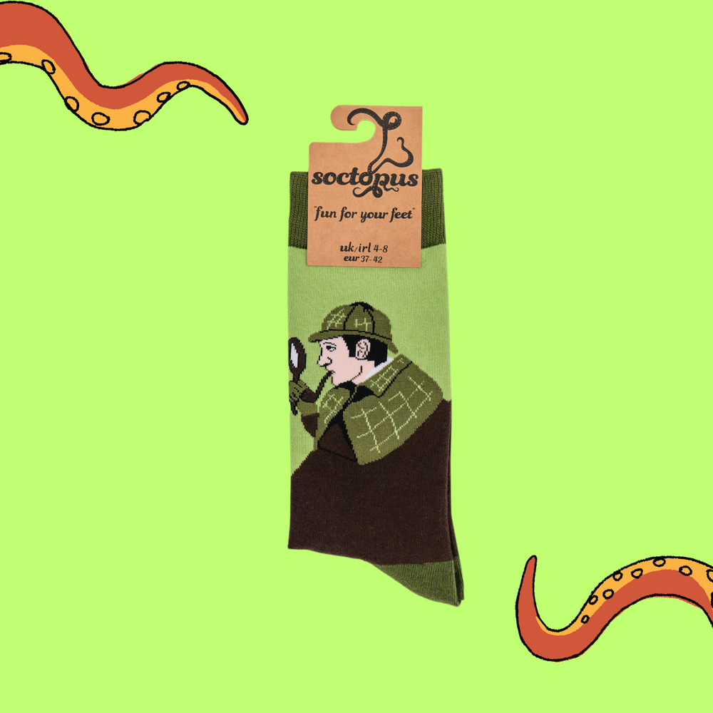 
                      
                         A pair of socks depicting Sherlock Holmes with hat and pipe. Brown legs, green cuff, heel and toe. In Soctopus Packaging.
                      
                    