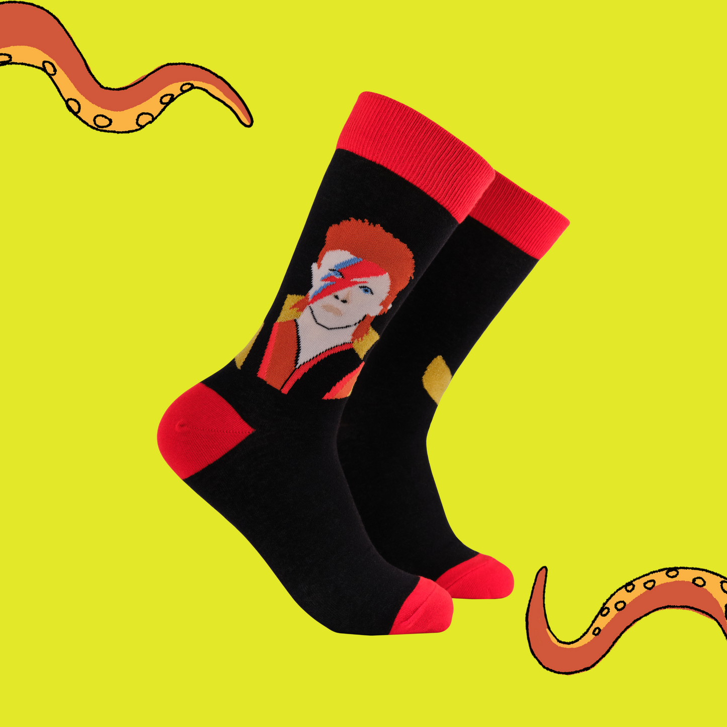 A pair of socks featuring the iconic david Bowie. Black legs, red heel, toe and cuff.