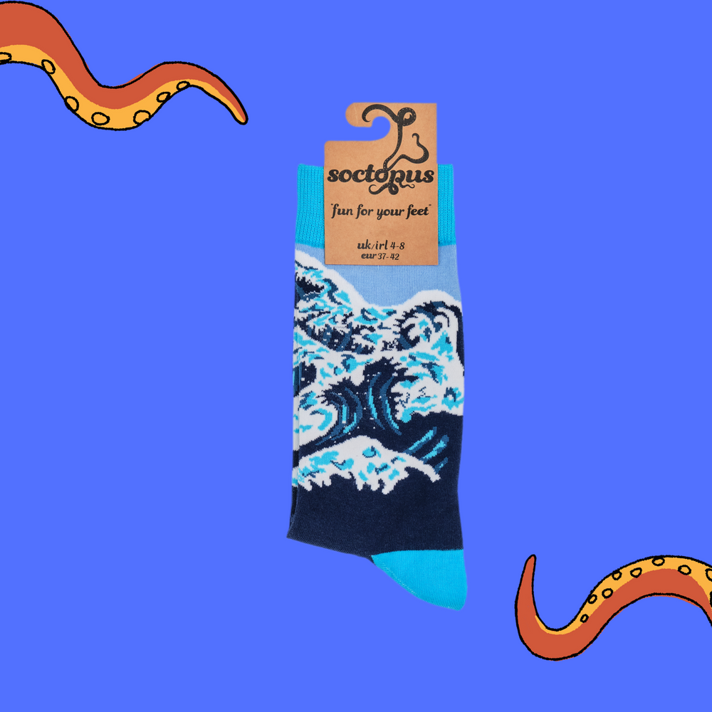 
                      
                        A pair of socks depicting The Great Wave off Kanagawa. Dark blue legs, bright blue cuff, heel and toe. In Socktopus Packaging.
                      
                    