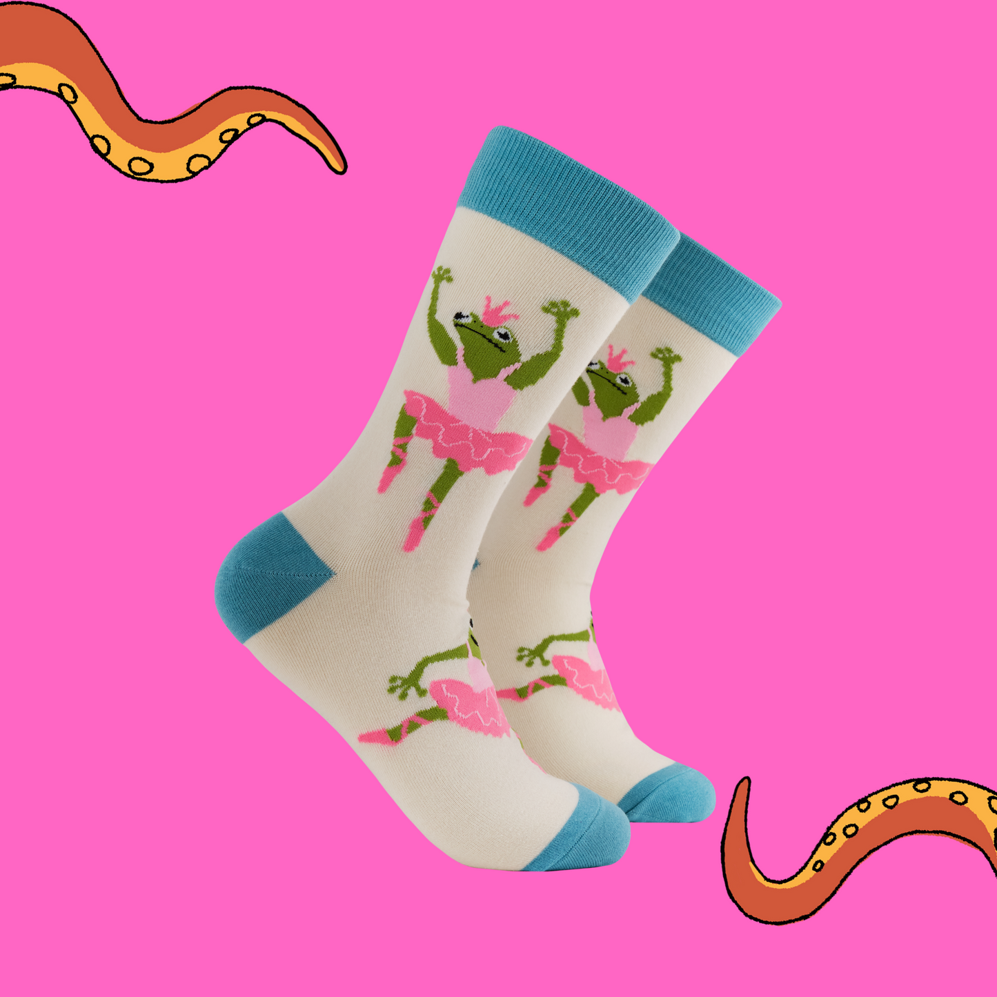 A pair of socks with a frog ballerina motif. Cream legs, light blue heel, toe and cuff. 