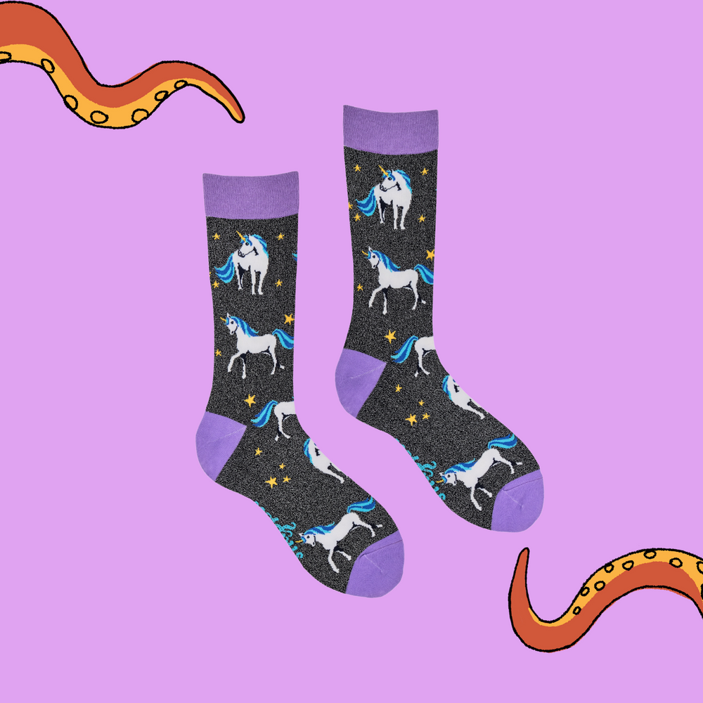 
                      
                        A pair of socks depicting unicorns. Glittery black legs, purple cuff, heel and toe.
                      
                    