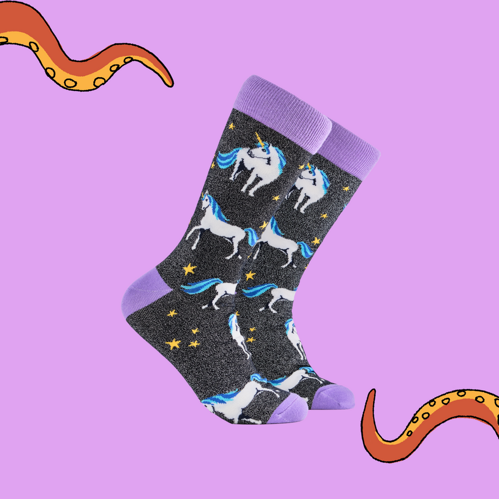 
                      
                        A pair of socks depicting unicorns. Glittery black legs, purple cuff, heel and toe.
                      
                    