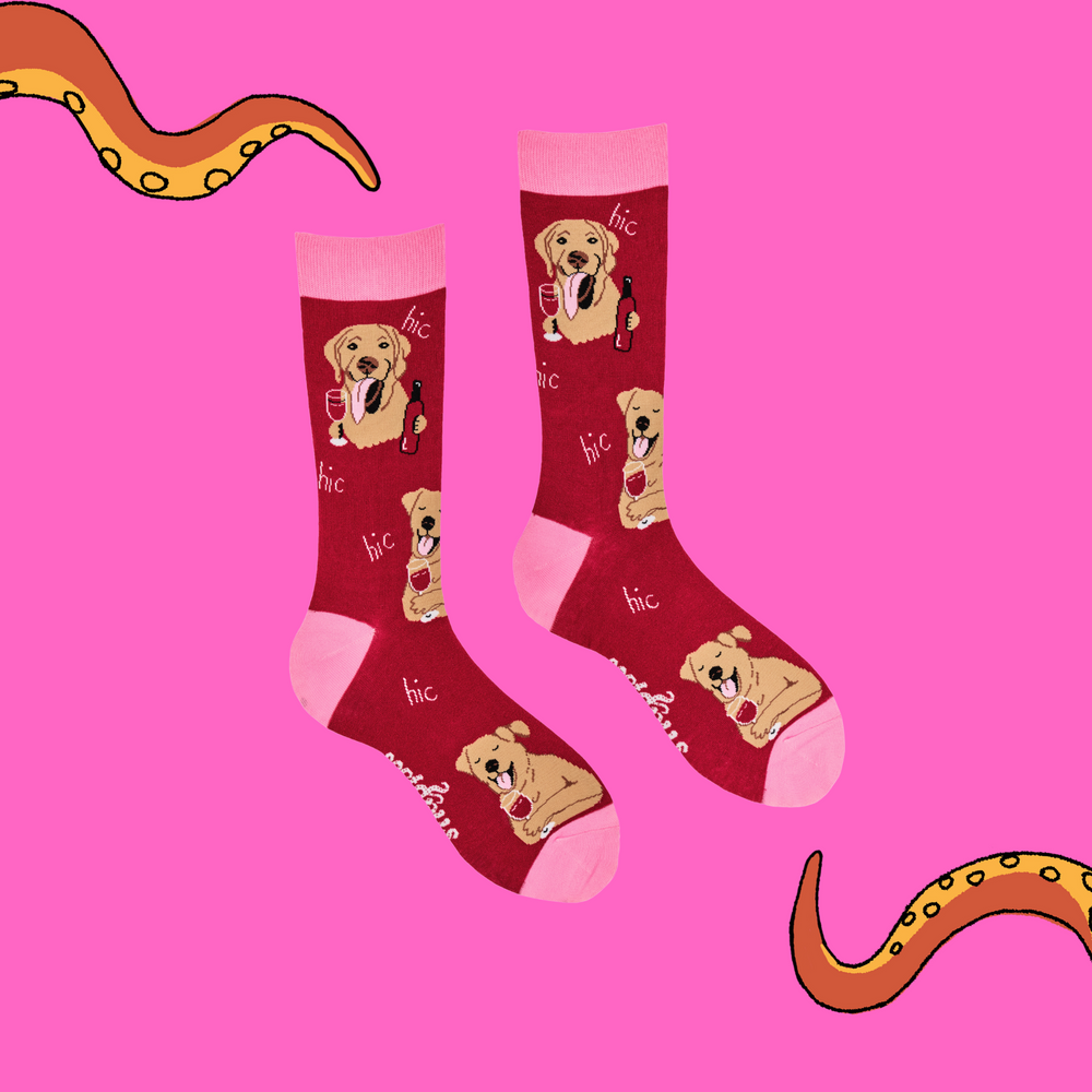 
                      
                        A pair of socks depicting labs drinking wine. Red legs, light pink cuff, heel and toe.
                      
                    