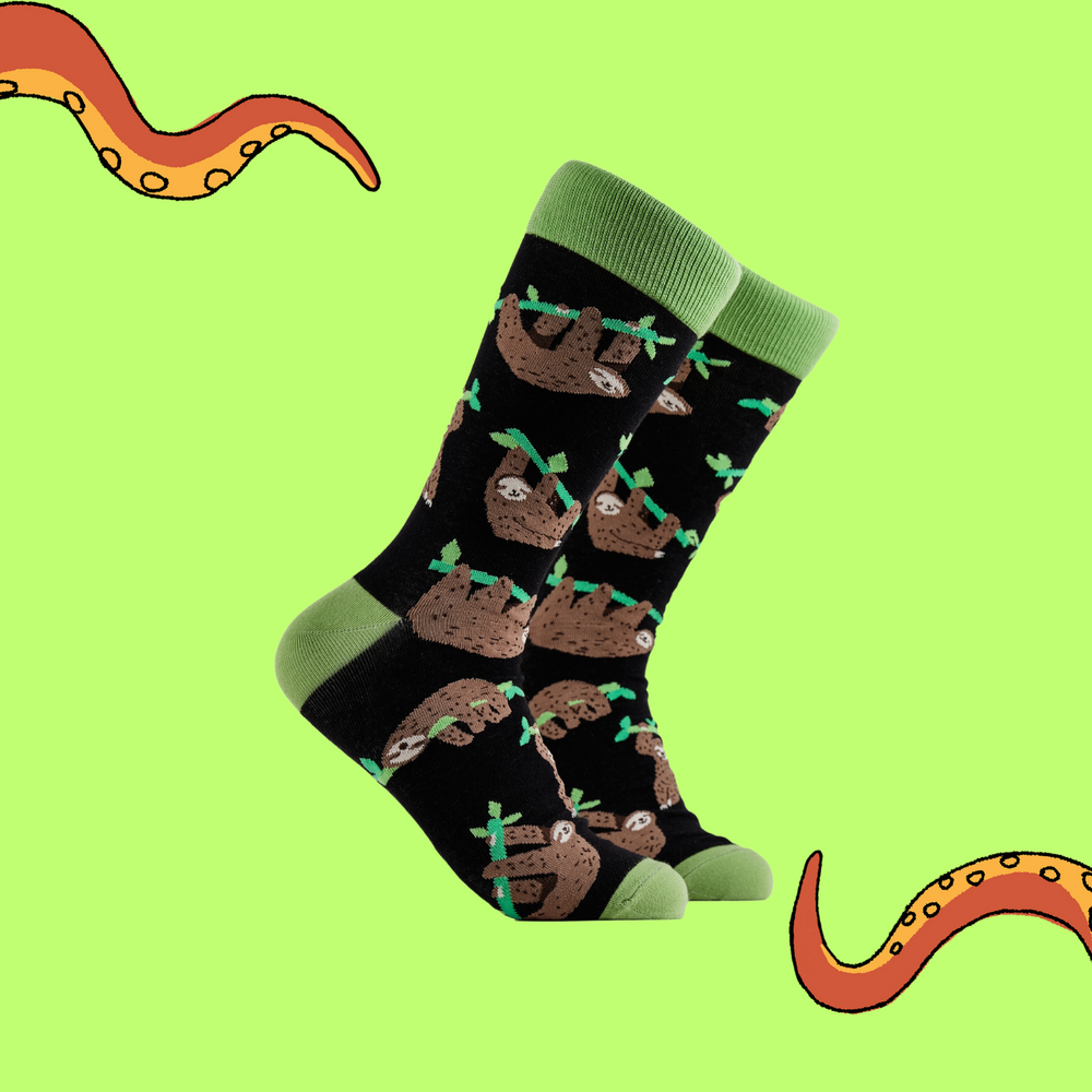 
                      
                        A pair of socks depicting lazy sloths. Black legs, green cuff, heel and toe.
                      
                    