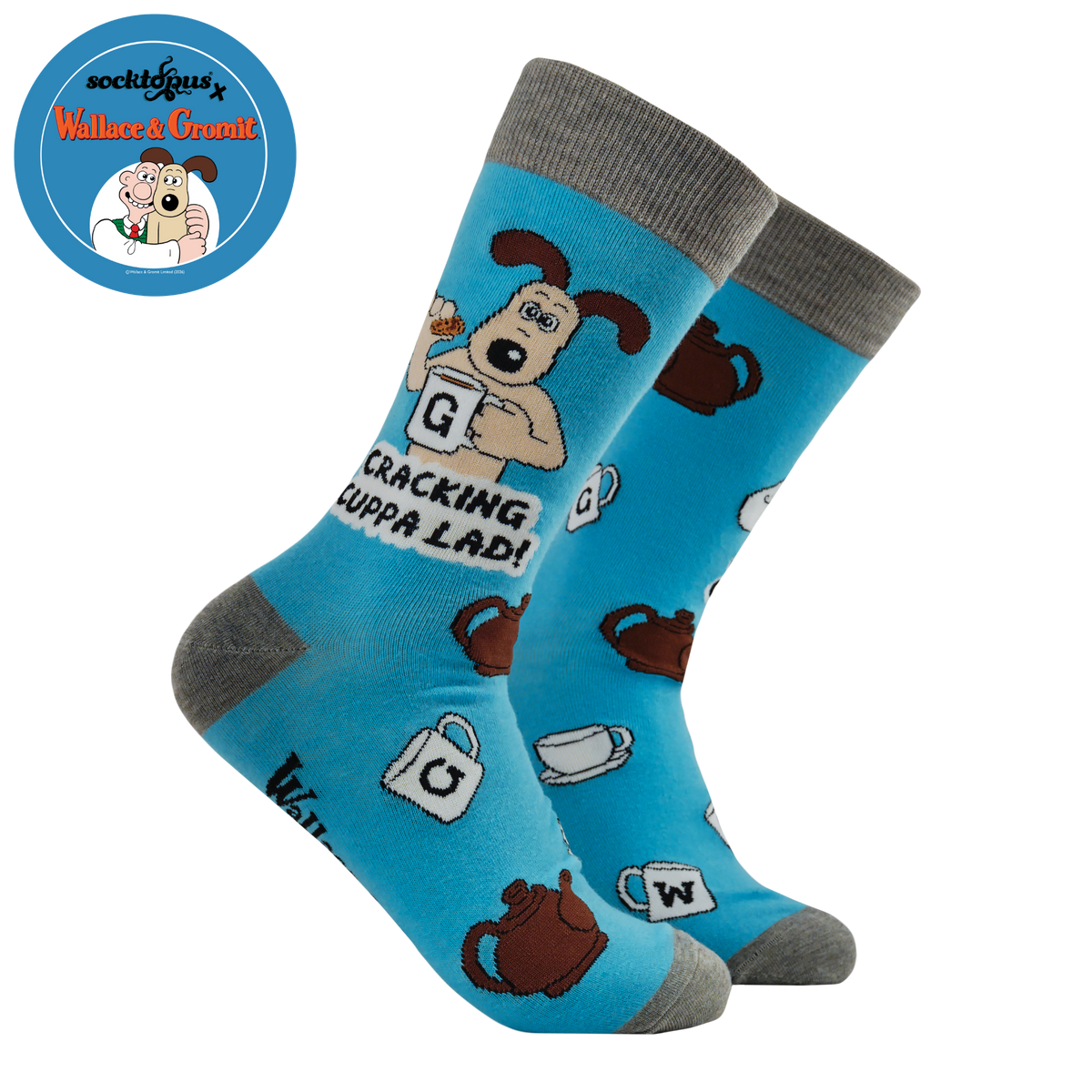 Blue socks with cartoon dog and tea-themed design on a white background

