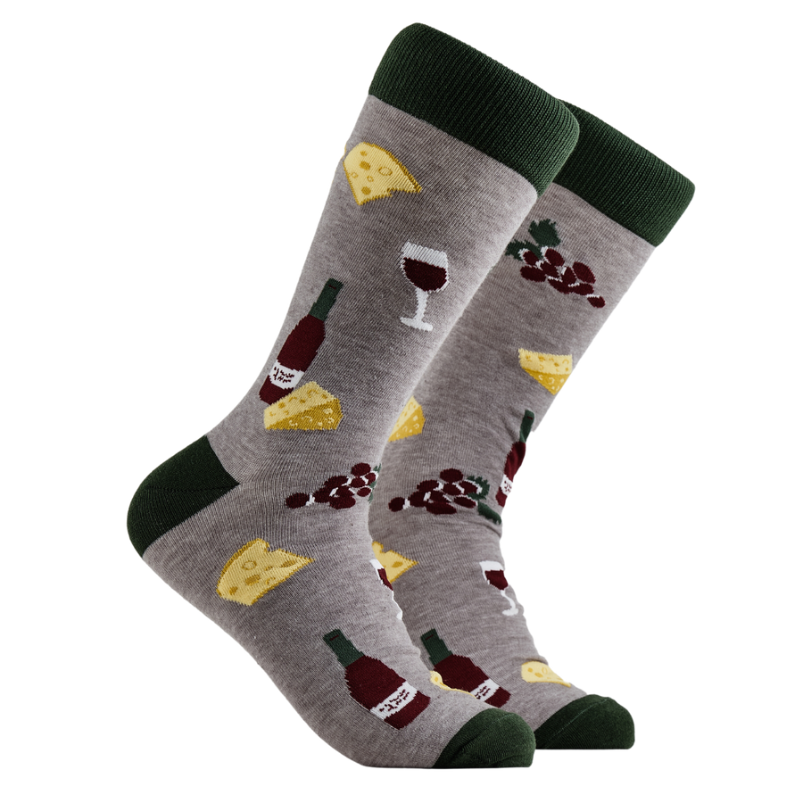 Charcuterie Socks - Cheese and Wine. A pair of socks depicting wine, cheese and grapes. Grey legs, green cuff, heel and toe.