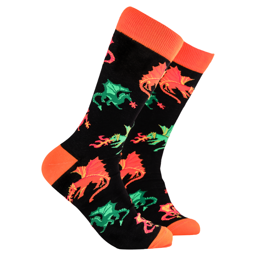 A pair of socks depicting fire breathing dragons. Black legs, orange cuff, heel and toe.