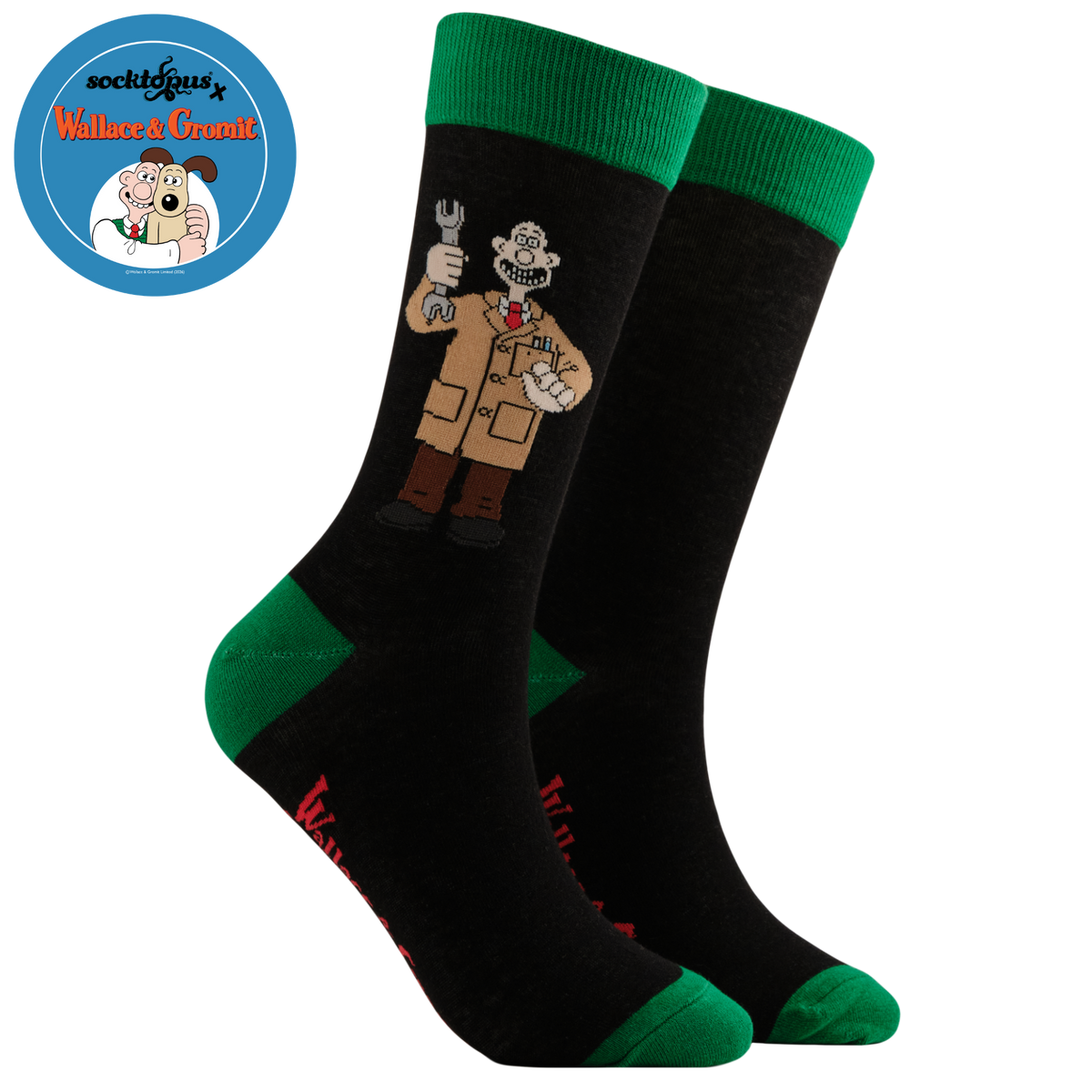 A pair of black crew socks with bright green cuffs, heels, and toes, featuring a cartoon character resembling a mechanic in a tan coat holding a wrench on the front sock.