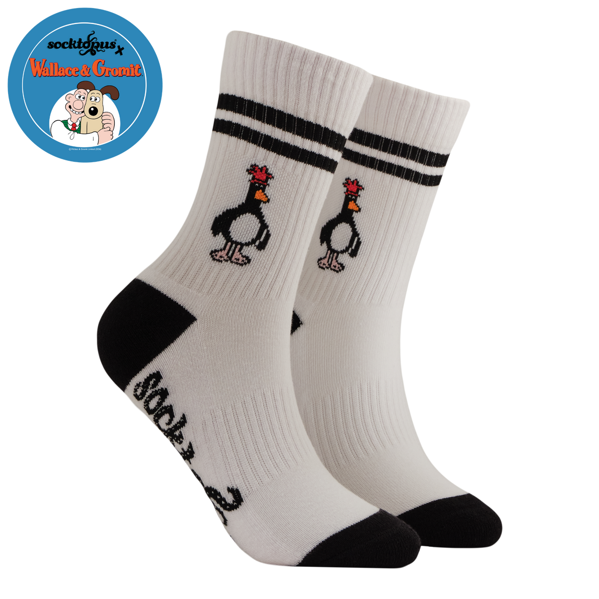 White socks with penguin design and black accents on a white background