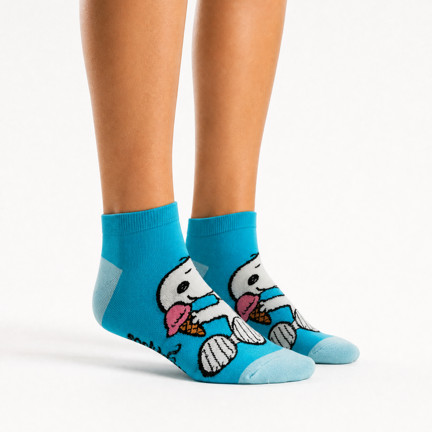 A pair of bright blue ankle socks with snoopy design. 