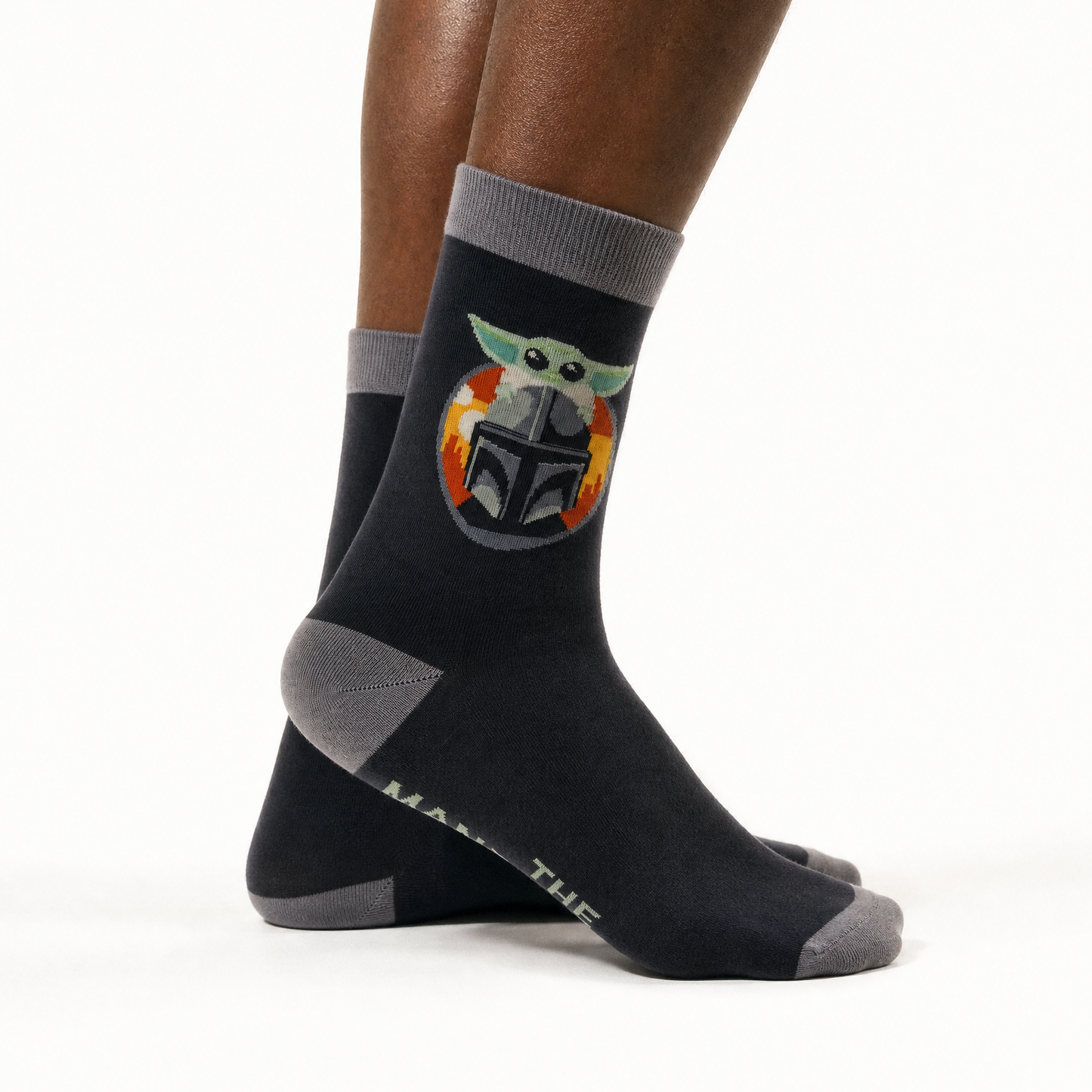 A pair of crew socks worn on a person's feet, shown against a clean white studio background. 