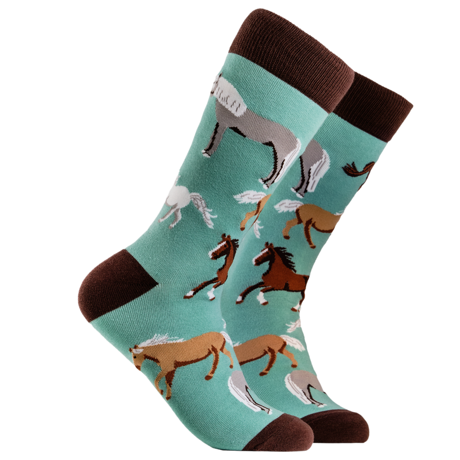 Horse Socks. A pair of socks depicting horses. Turquoise legs, brown cuff, heel and toe.