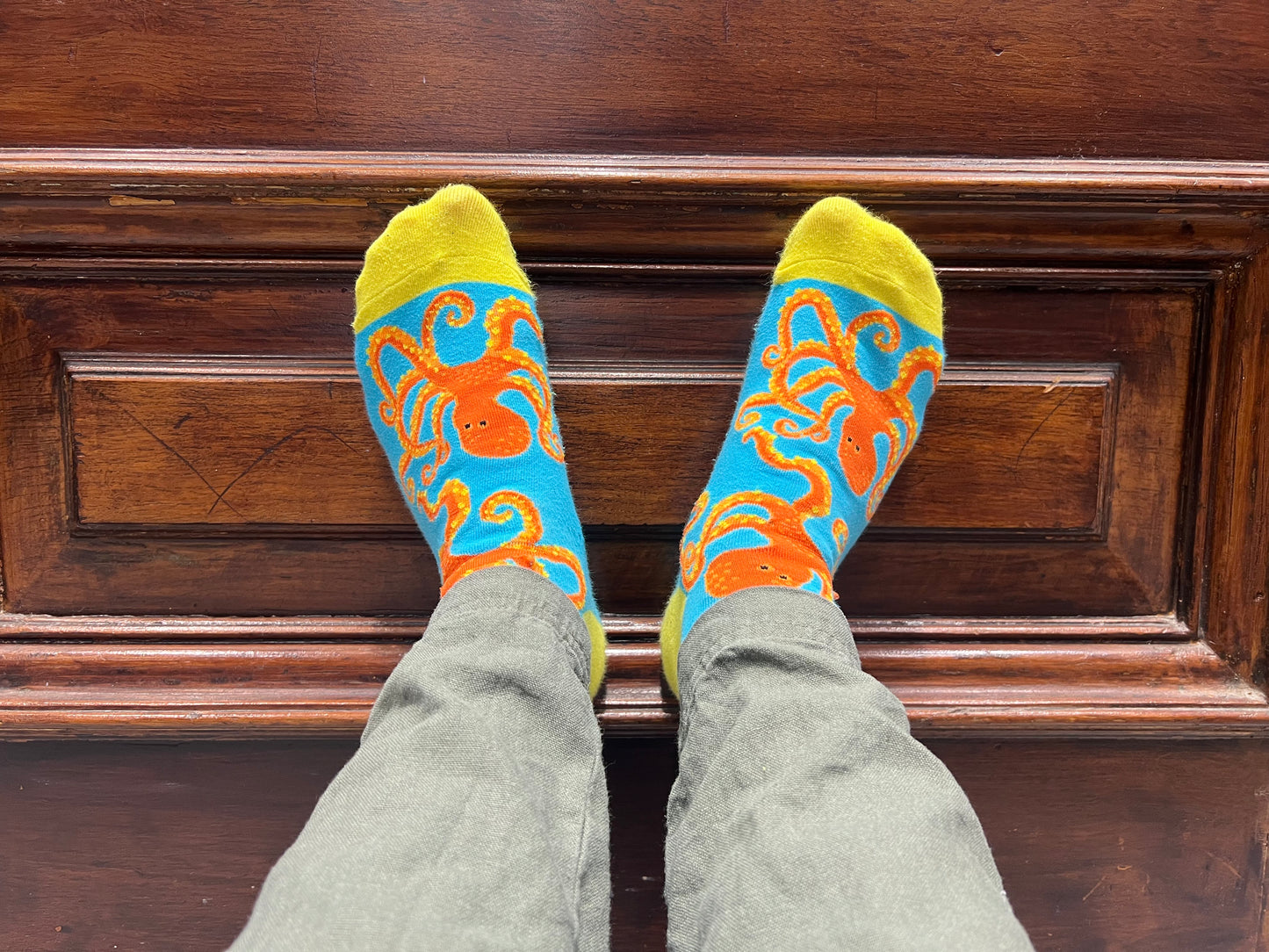 Jamie wearing a pair of Captain Soctopus socks. 