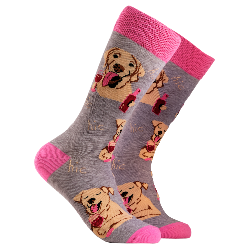 
                      
                        A pair of socks depicting labs drinking wine. Grey legs, light pink cuff, heel and toe.
                      
                    