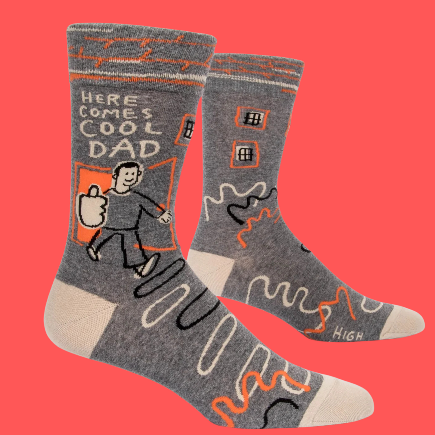 Here Comes Cool Dad Socks. A pair of socks featuring a cool dad motif. Grey legs, cream heel, toe and cuff. 