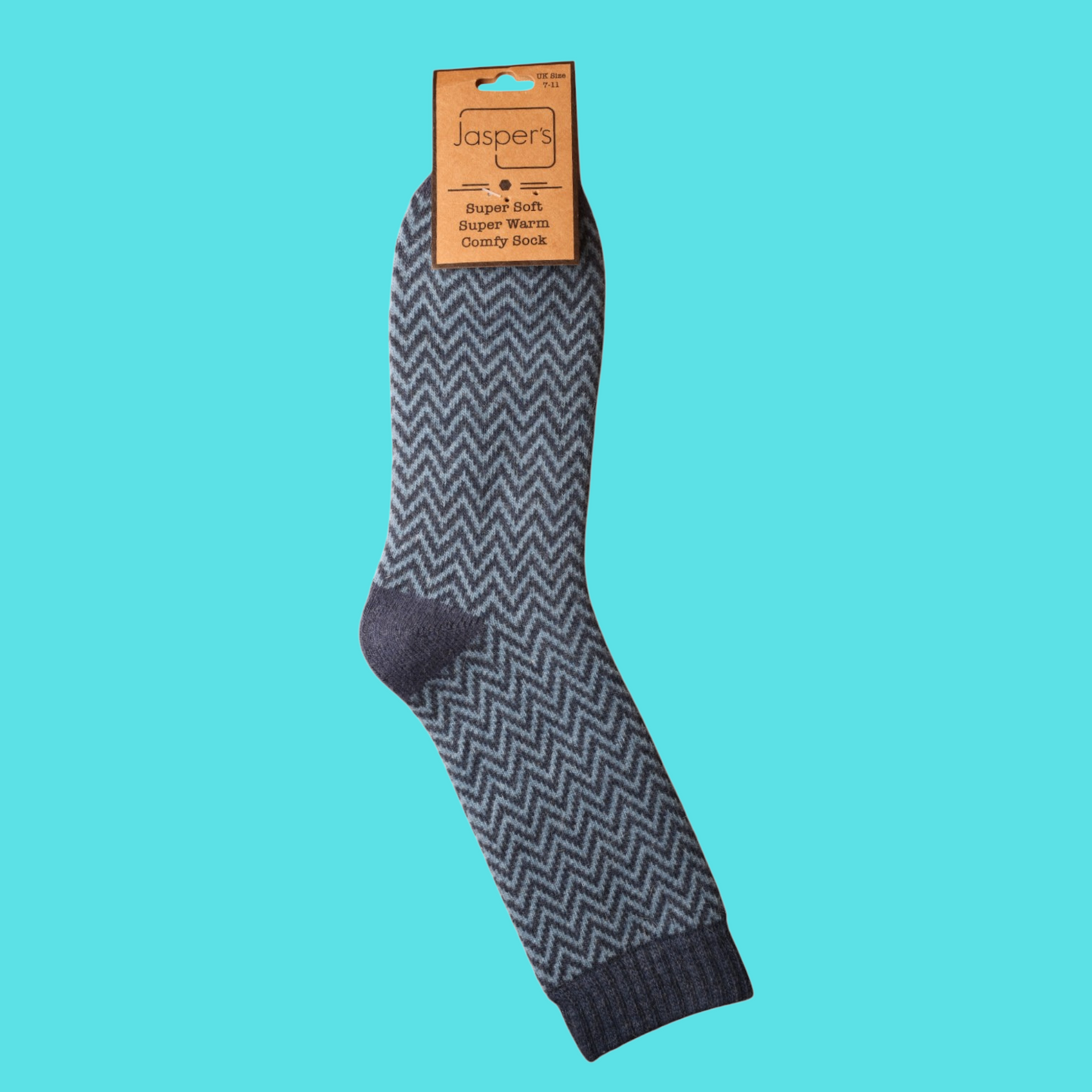 Gray herringbone patterned sock with a brand label on a teal background