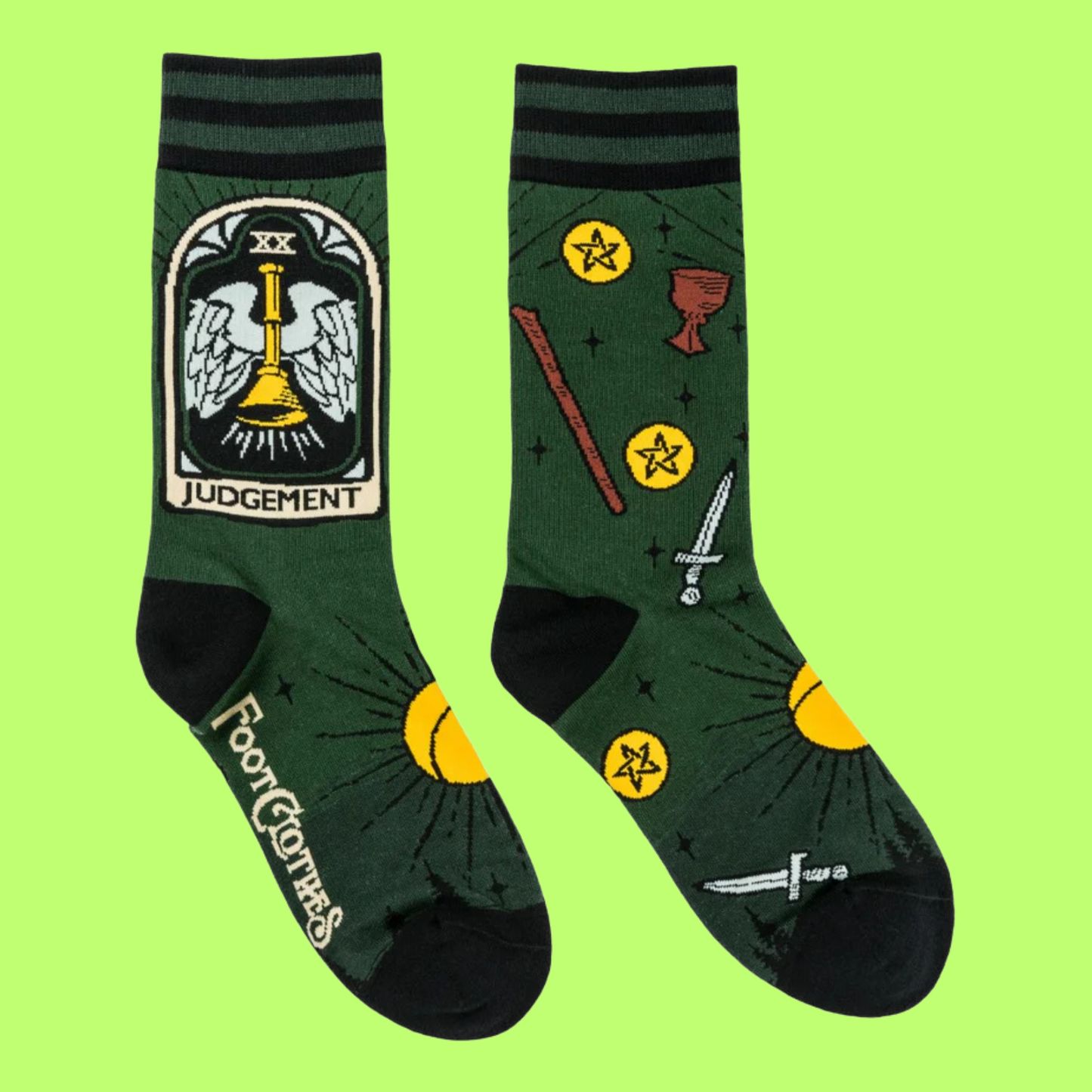 A pair of socks featuring tarot cards and symbols. Green legs, black heel, toe and cuff. 