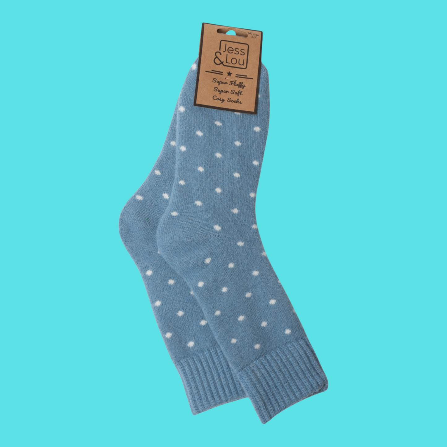 Blue socks with white polka dots on a turquoise background, featuring a label.