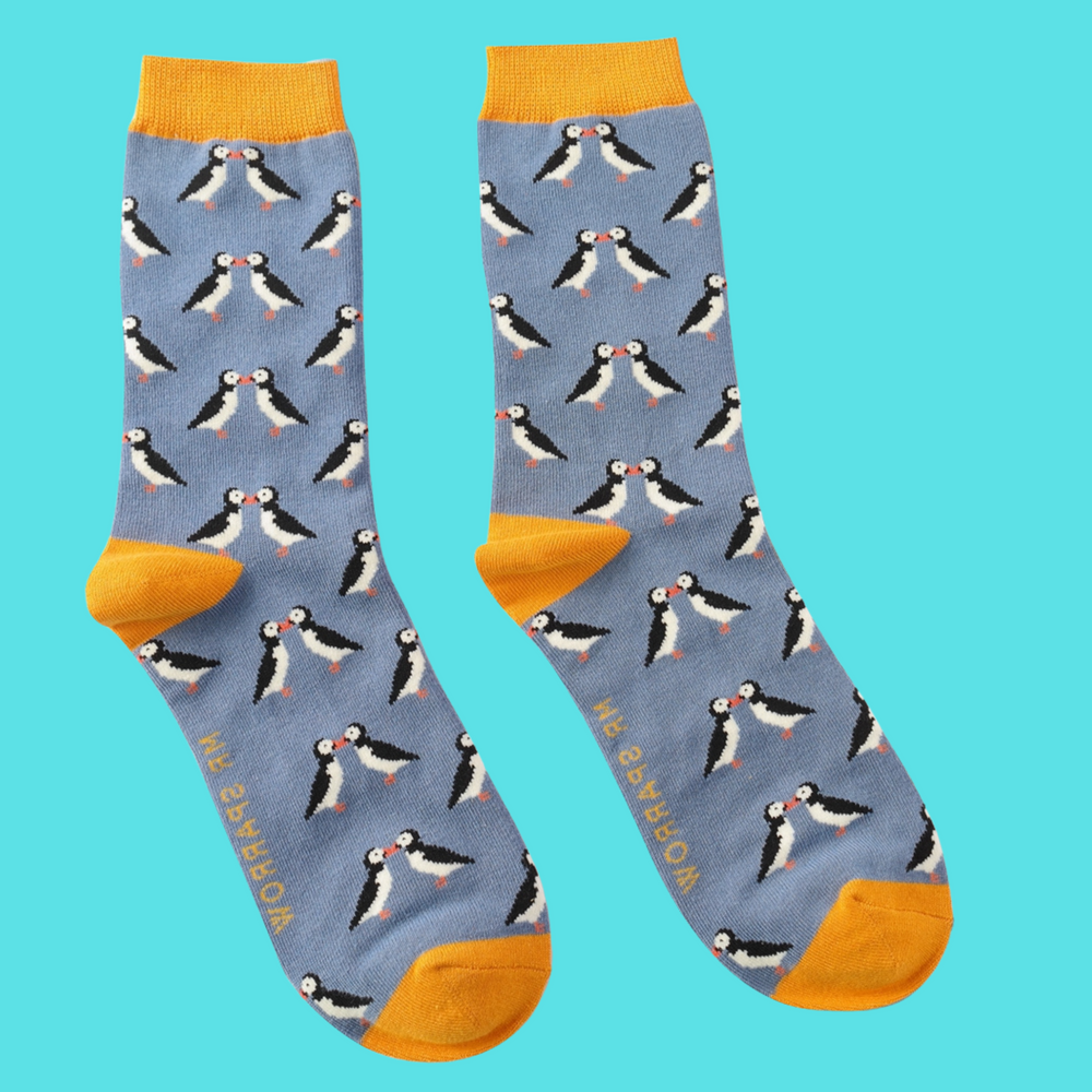 Puffins Bamboo Socks - Miss Sparrow. A pair of socks with a puffin motif. Blue legs, yellow heel, toe and cuff. 