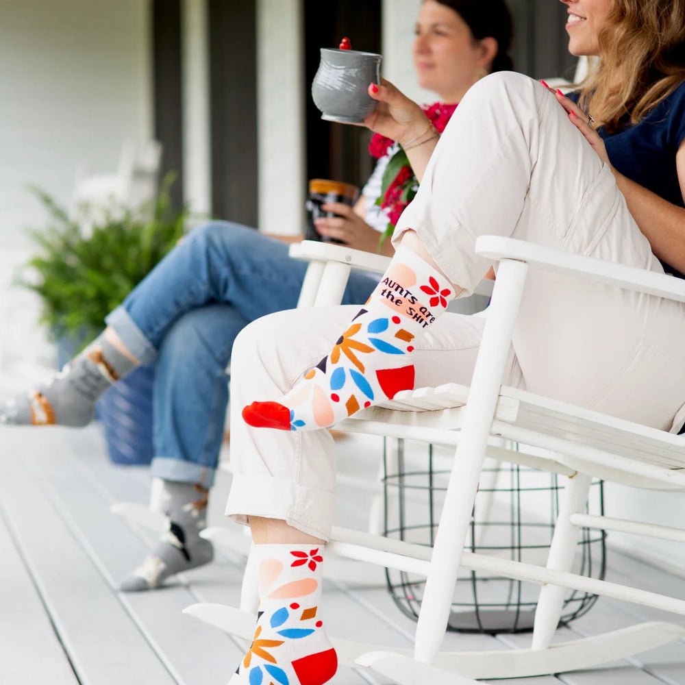 
                      
                        Aunts are the S**t Socks. A pair of socks with a floral pattern and a sweary slogan. 
                      
                    