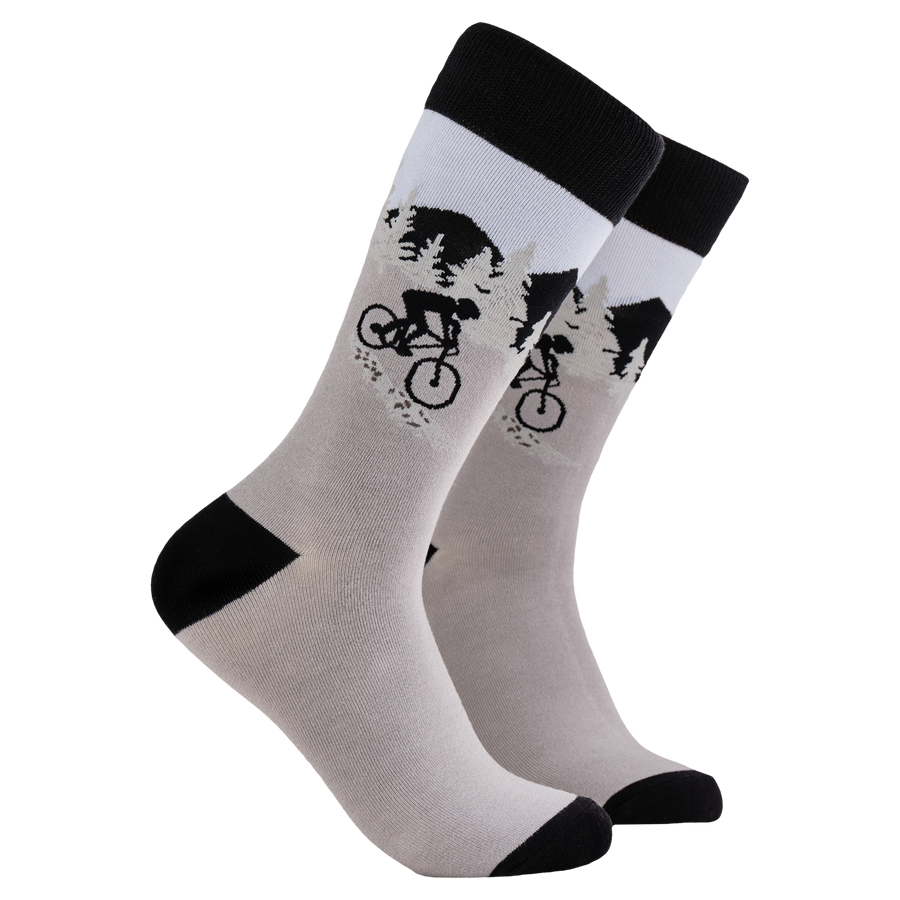 Mountain Bike Socks - Vicious Cycle. A pair of socks depicting a mountain biker. Grey legs, black heel toe and cuff. 