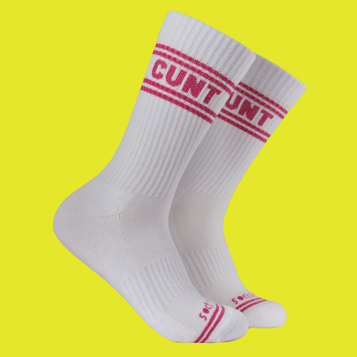 A white pair of athletic socks with red trim on the ankles and toes. A euphemism for the female genitals on the ankle.