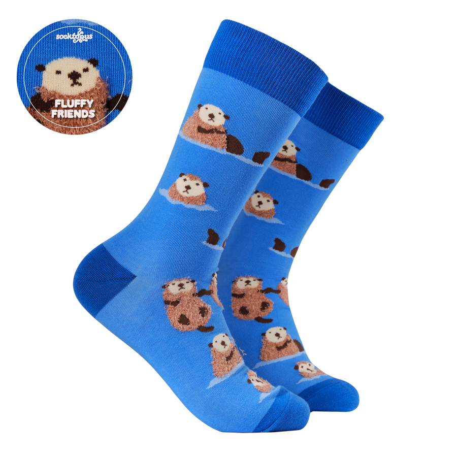 Fluffy Otter Socks. A pair of blue socks with a fluffy otter design. Light blue legs, dark blue heel, toe and cuff. 