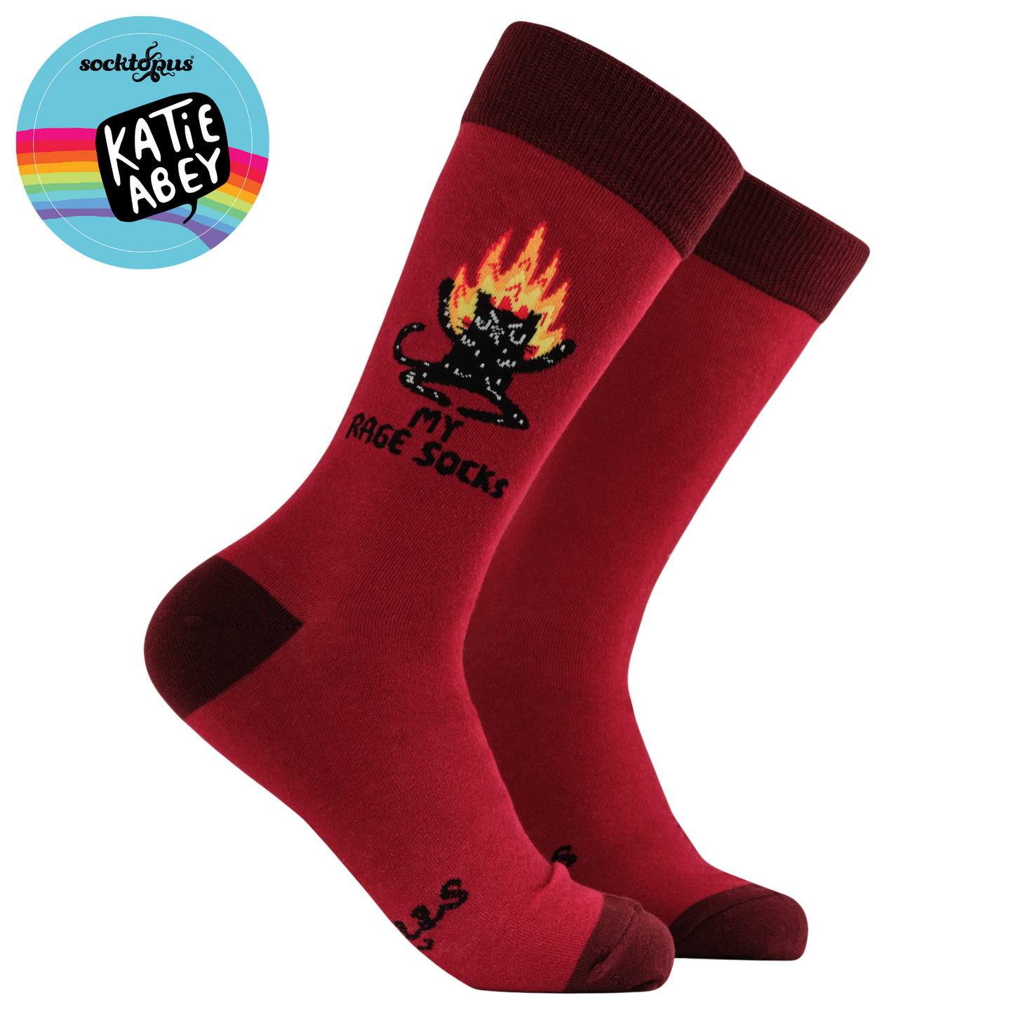 Red socks with a black cat design and 'Katie Abey' branding on a white background.